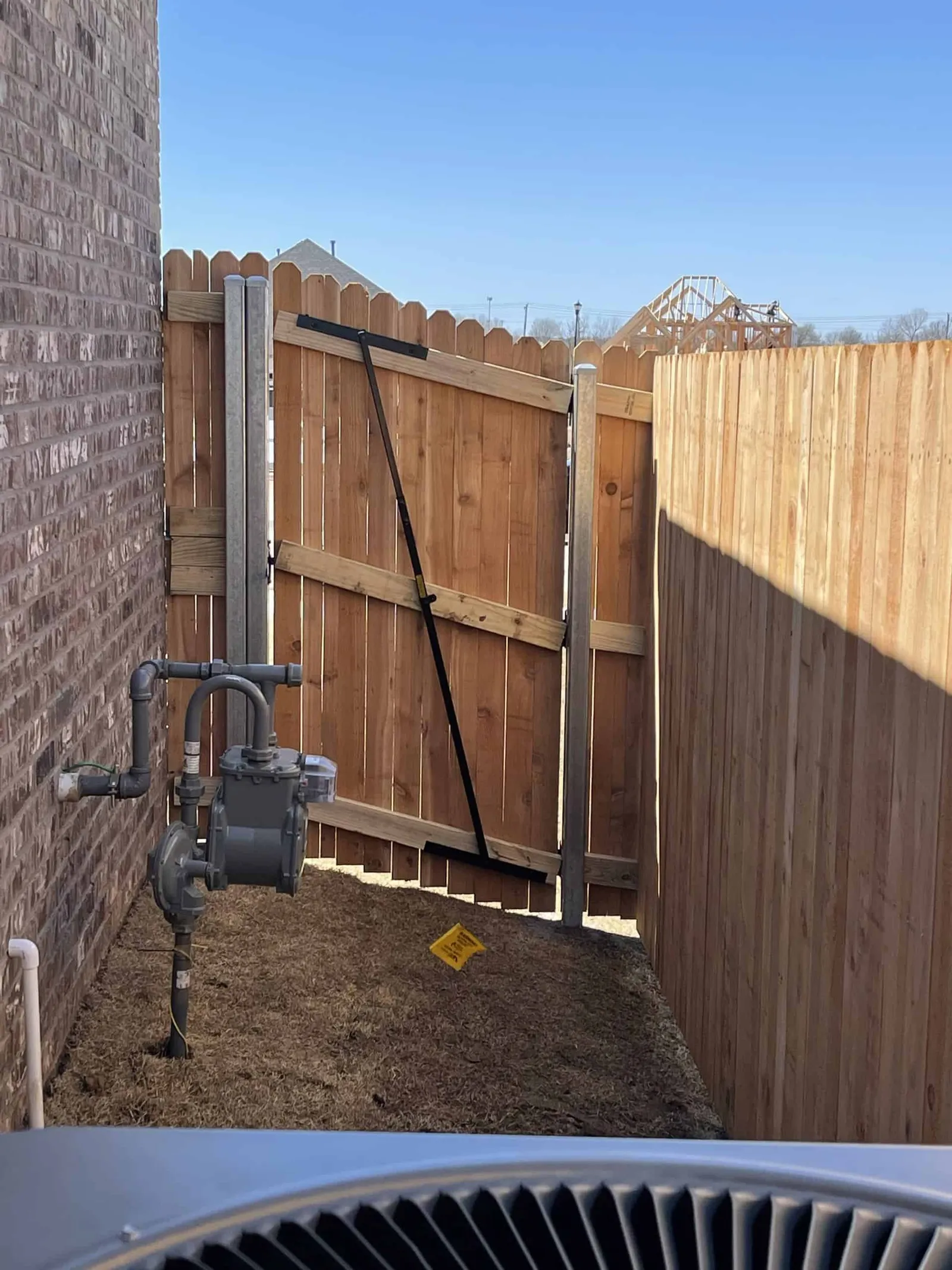 Wood privacy fence in a Tulsa backyard during winter weather