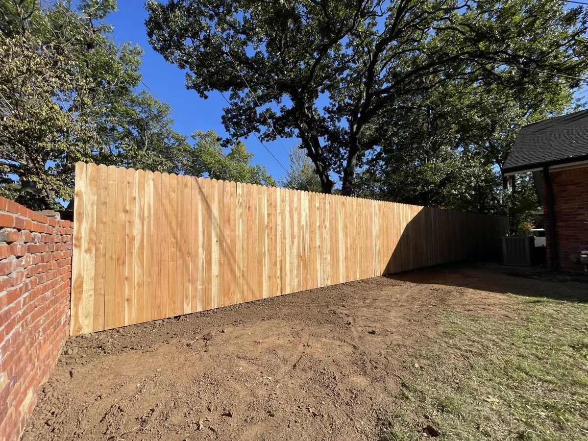 New cedar privacy fence with dog-ear pickets, a privacy fence Tulsa, OK install