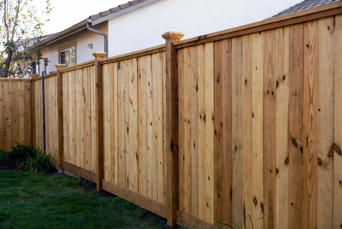 Cedar fence with decorative post caps restored, fence repair Tulsa, OK done right