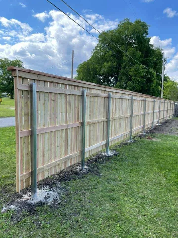 Cedar capped privacy fence with steel posts, a privacy fence near me Tulsa, OK build