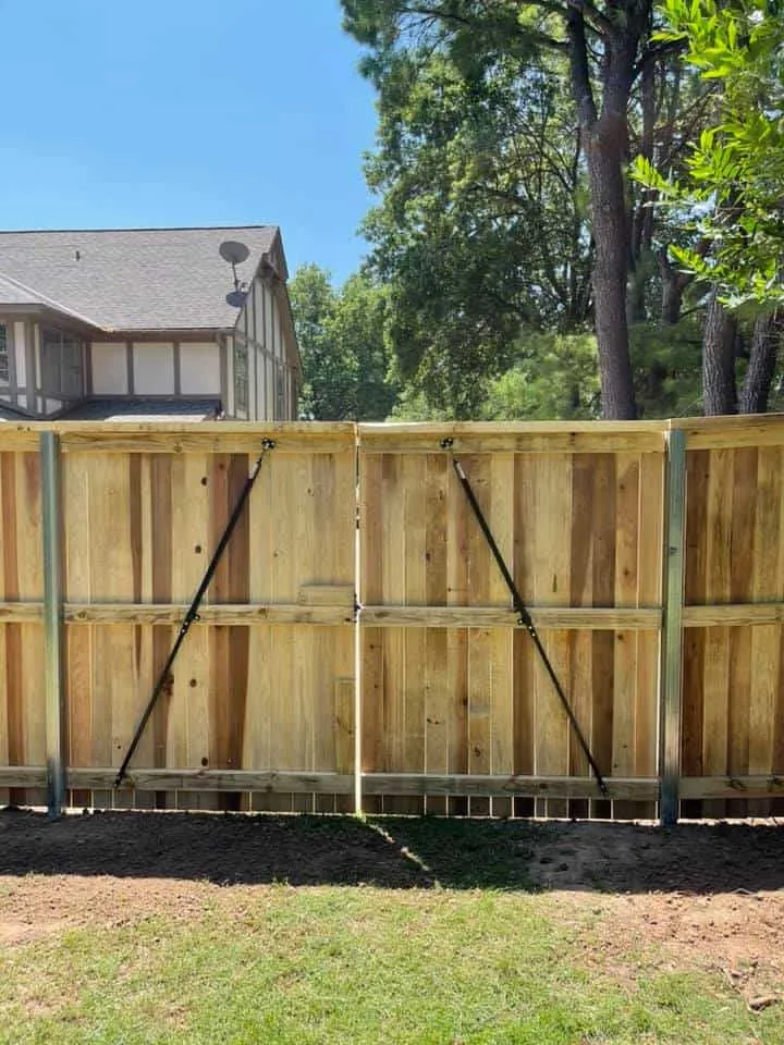 Cedar double swing gate set into a privacy fence run, built by a fence company in Tulsa, OK