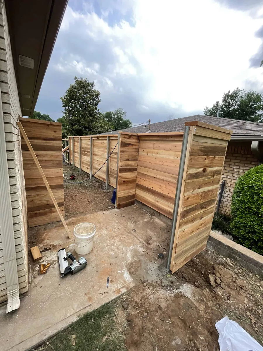 Cedar privacy fence enclosing a residential backyard, one of our privacy fence styles Tulsa, OK