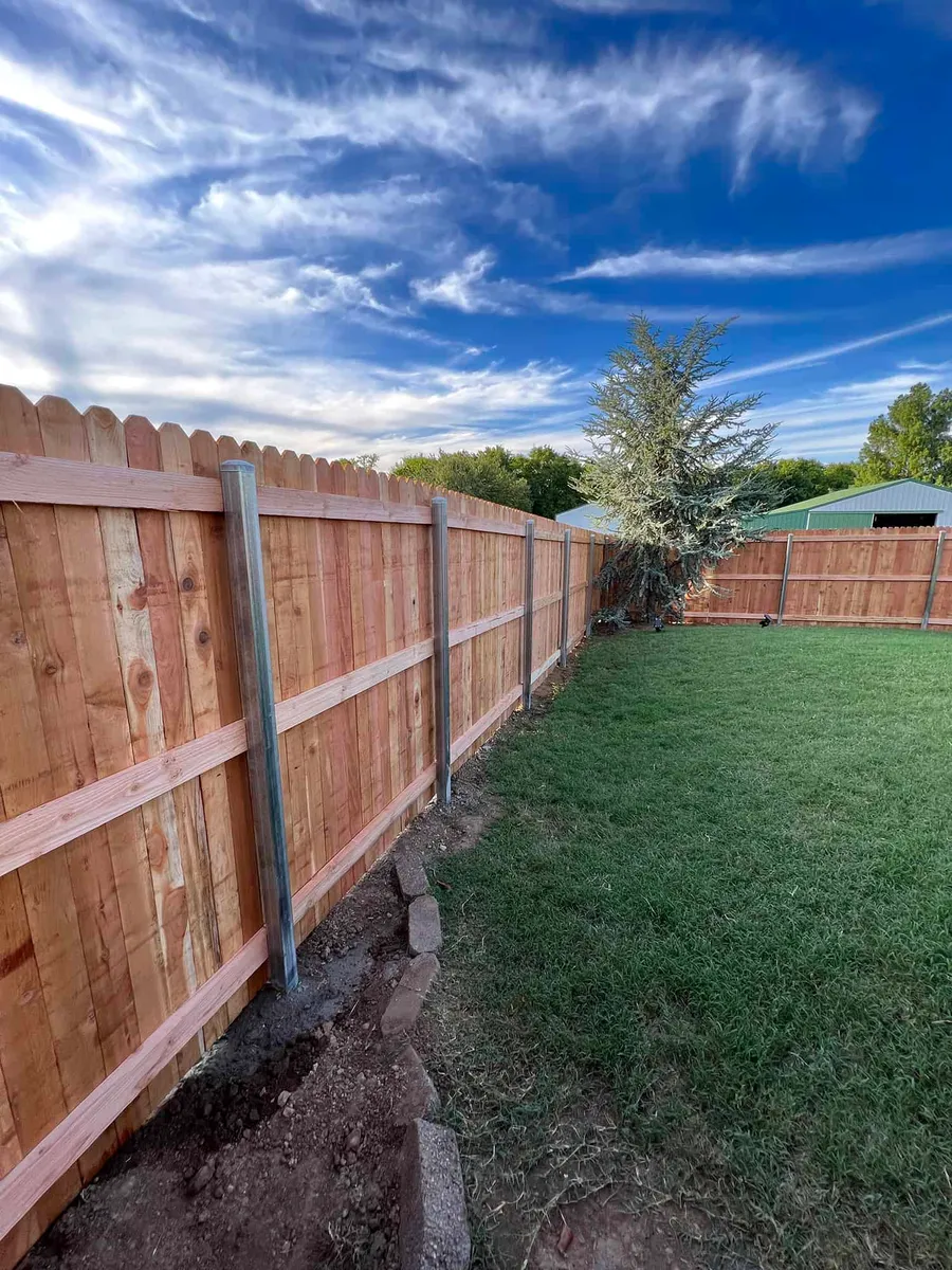 Cedar privacy fence built on galvanized steel posts for wind strength, a privacy fence Tulsa, OK install