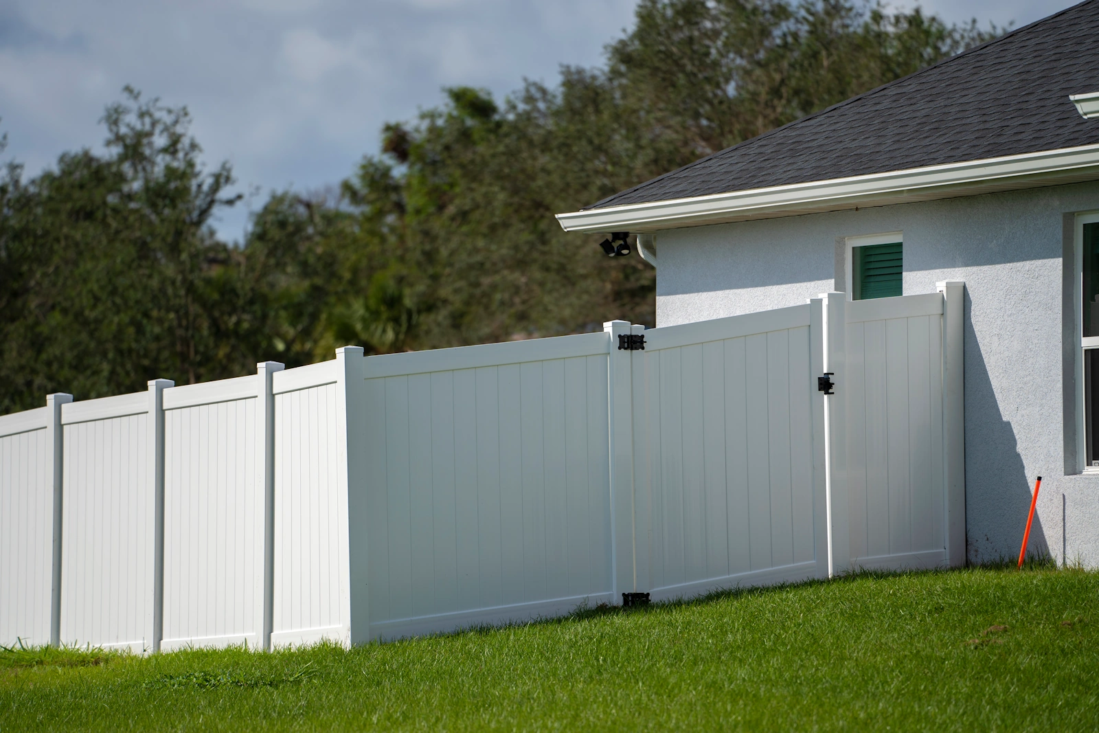 White vinyl privacy fence enclosing a clean backyard in Tulsa, OK