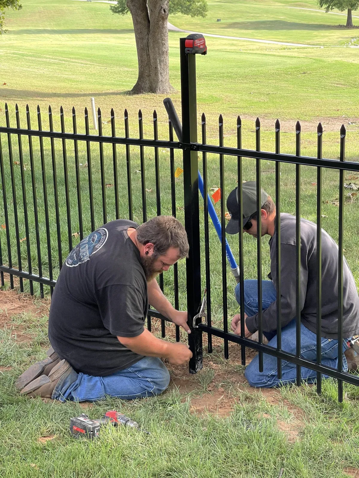 Crew installing one of the popular types of fences Tulsa, OK homeowners choose