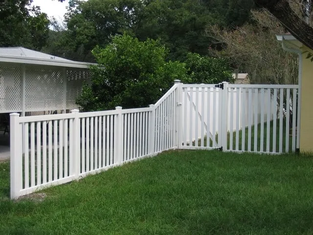White vinyl semi-privacy fence and gate in a backyard, a vinyl fence in Tulsa, OK